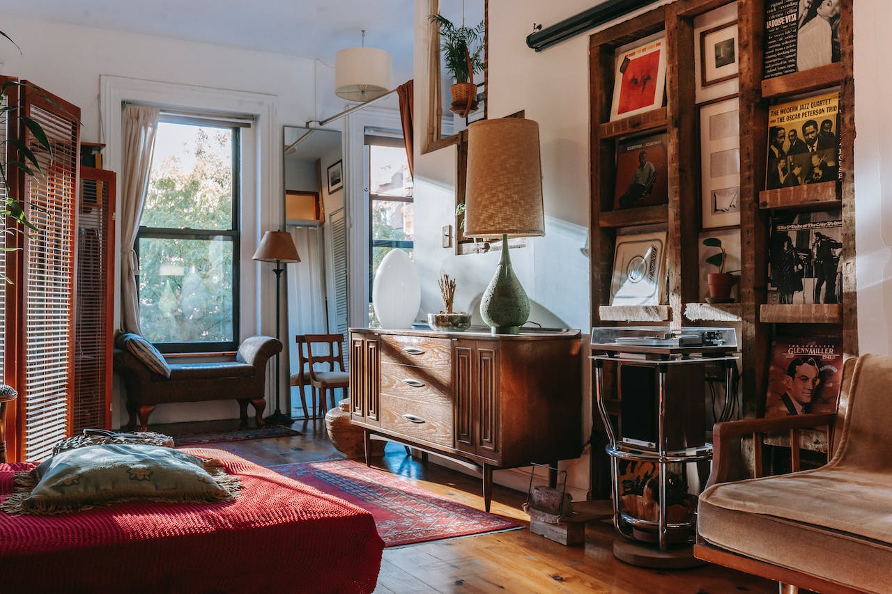 Photo by Charlotte May: https://www.pexels.com/photo/interior-of-cozy-studio-with-bed-and-couch-decorated-with-vintage-furniture-and-vinyl-records-5824519/